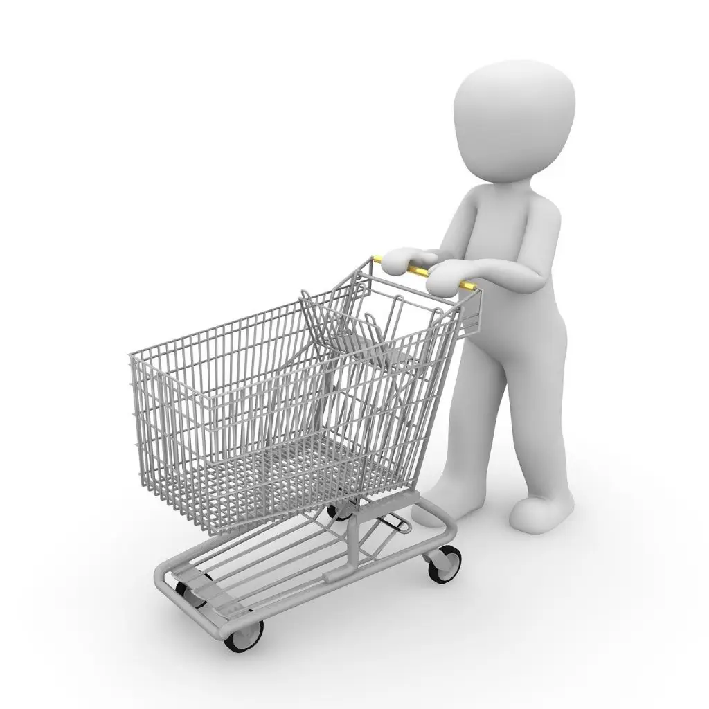 Person shopping online using laptop with discount icons and smart saving tips